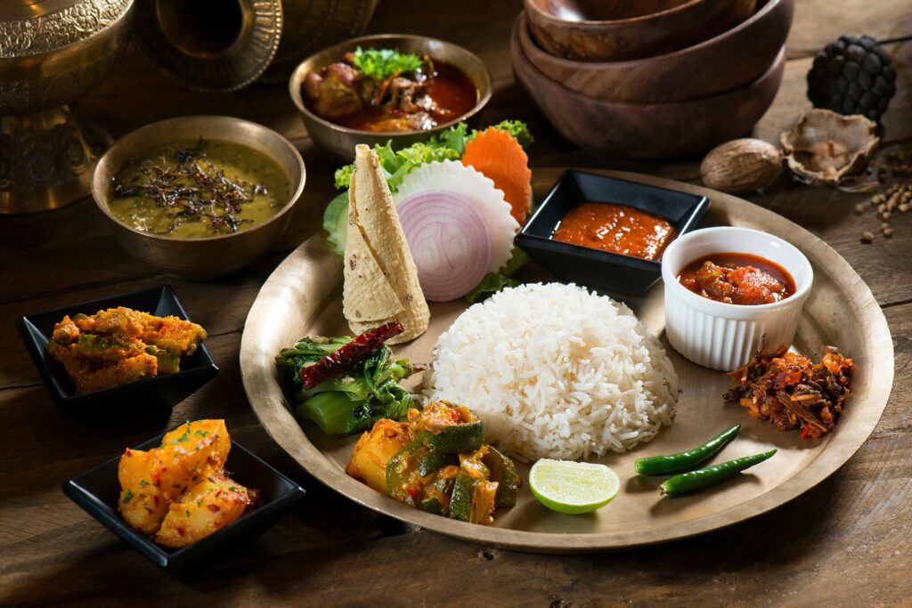 Traditional dal bhat set with rice, lentils, curry, and pickles, 10 Must-Try Nepali Foods (with Culture & Origins), Nepali food, Nepal travel tips, what to eat in Nepal, Nepal food, foodie in Nepal, saru's postcards