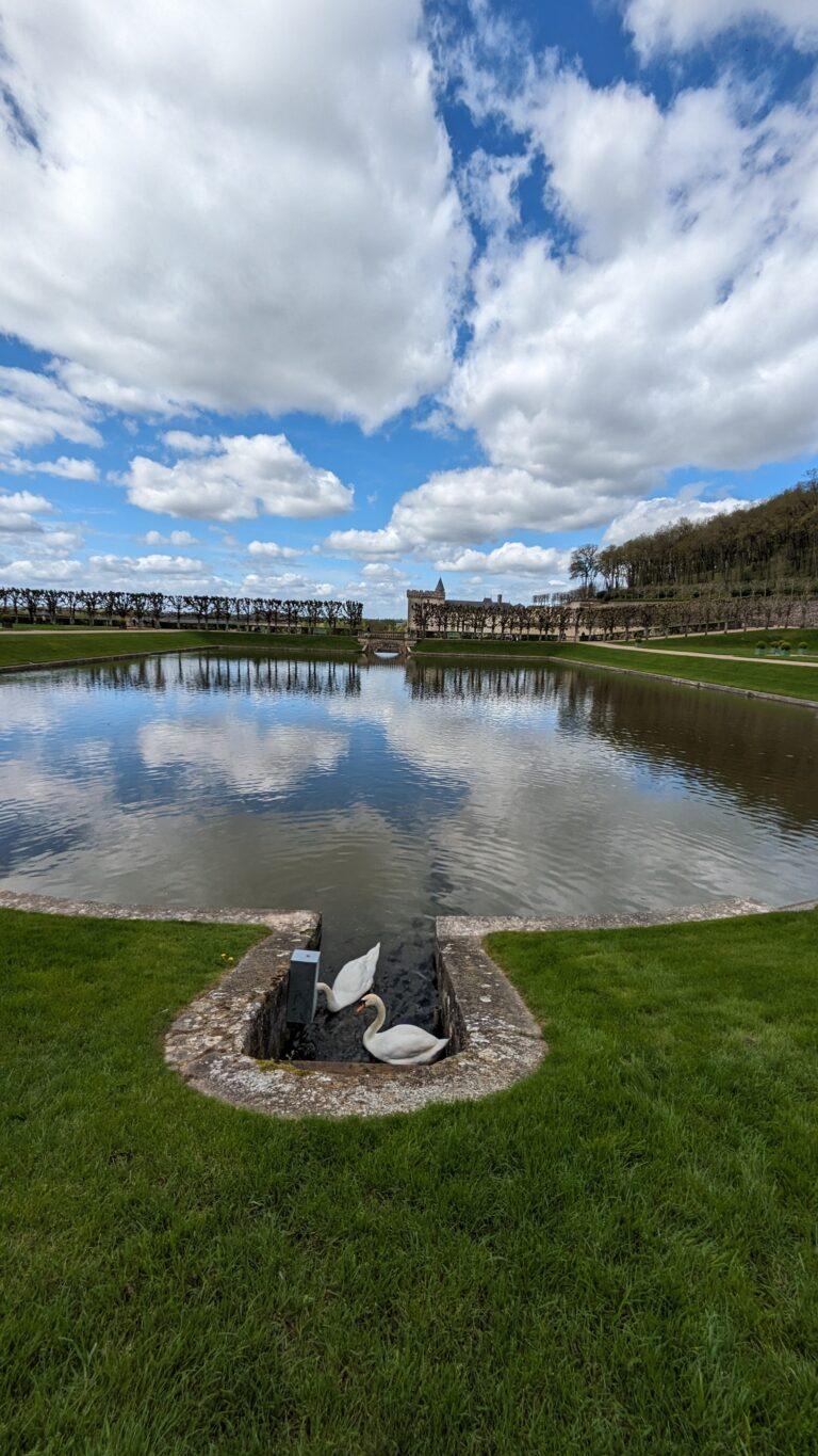 Villandry Castle Loire Valley aerial view with gardens, Renaissance ornamental gardens at Château de Villandry geometric patterns, Villandry water garden with fountains and reflective pools, Château de Villandry vegetable garden colorful seasonal plants, Villandry castle façade with Renaissance architecture, Château de Villandry terrace view overlooking formal gardens, Villandry herb garden with neatly arranged sections, Sunset at Villandry Castle golden light on the gardens, Visitors walking through Villandry Castle grounds, Château de Villandry in spring tulips and vibrant flowers, A Day at Villandry Castle: Where Gardens Steal the Show