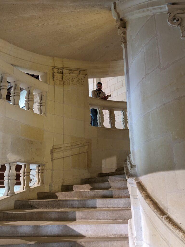 A Day at Château de Chambord: The Crown Jewel of the Loire Valley, Château de Chambord aerial view Loire Valley largest castle, Chambord Castle double helix staircase designed by Leonardo da Vinci, Château de Chambord façade with Renaissance and medieval architecture, Chambord Castle rooftop terraces with chimneys and spires, Château de Chambord grand entrance courtyard with visitors, Interior of Chambord Castle ornate ceiling and stone carvings, Château de Chambord reflected in moat at sunrise, Chambord Castle hunting lodge history exhibition room, Château de Chambord gardens and surrounding forest, Night view of Chambord Castle illuminated against dark sky