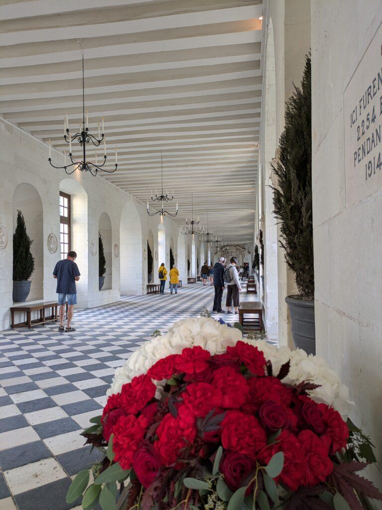 Château de Chenonceau on the River Cher Loire Valley iconic castle reflection, Aerial view of Chenonceau Castle stretching across the river Renaissance architecture, Interior of Château de Chenonceau grand gallery with arched windows, The Apothecary of Chenonceau Castle historic cabinets and jars, Chenonceau gardens in spring colorful flowers and symmetrical design, A Day at Chenonceau Castle: The Jewel of the Loire Valley, Castle façade of Chenonceau at sunrise soft golden light over the river, Château de Chenonceau during autumn warm colors surrounding the castle, Historic kitchen of Chenonceau Castle copper pots and stone arches, Visitors walking across the gallery bridge at Château de Chenonceau, Night view of Chenonceau Castle illuminated reflections on the Cher River