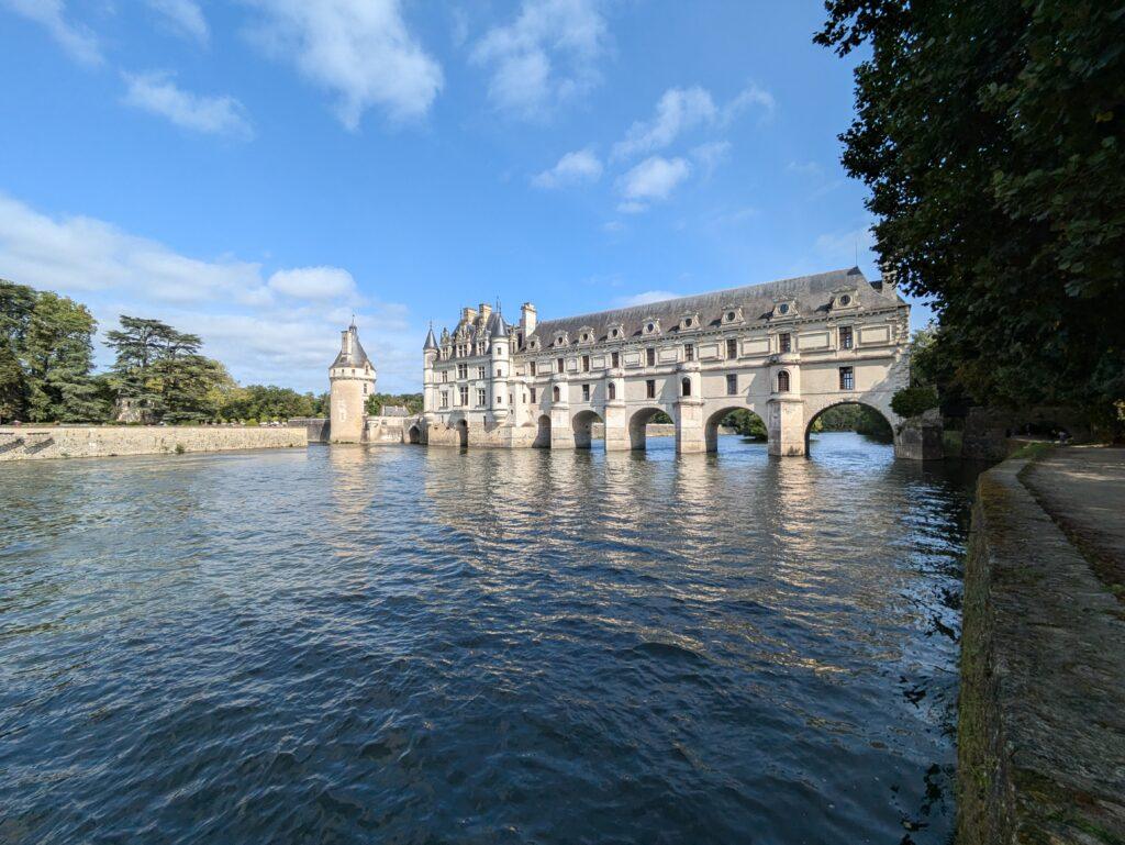 Château de Chenonceau on the River Cher Loire Valley iconic castle reflection, Aerial view of Chenonceau Castle stretching across the river Renaissance architecture, Interior of Château de Chenonceau grand gallery with arched windows, The Apothecary of Chenonceau Castle historic cabinets and jars, Chenonceau gardens in spring colorful flowers and symmetrical design, A Day at Chenonceau Castle: The Jewel of the Loire Valley, Castle façade of Chenonceau at sunrise soft golden light over the river, Château de Chenonceau during autumn warm colors surrounding the castle, Historic kitchen of Chenonceau Castle copper pots and stone arches, Visitors walking across the gallery bridge at Château de Chenonceau, Night view of Chenonceau Castle illuminated reflections on the Cher River