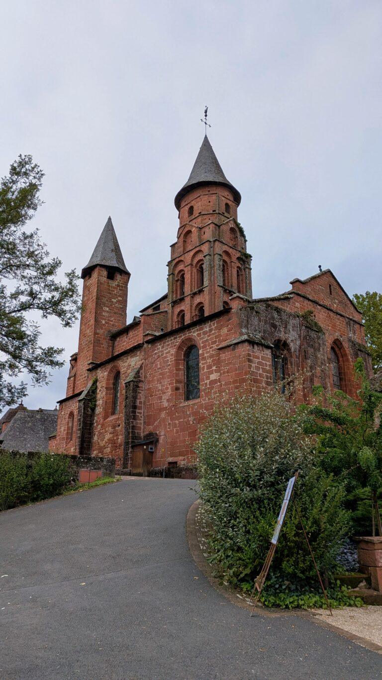 Saint-Pierre church, Collonges-la-Rouge, Romanesque architecture, octagonal bell tower,Collonges-la-Rouge: The Red Stone Gem of France, Collonges-la-Rouge village, red sandstone houses, medieval architecture, Limousin France, Collonges-la-Rouge alley, red stone walls, flowered balconies, charming street, saru's postcards, beautiful villages of France