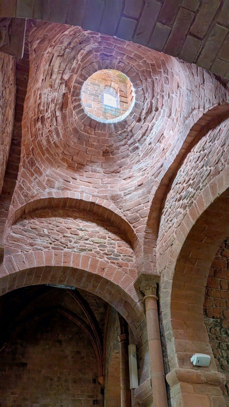 Saint-Pierre church, Collonges-la-Rouge, Romanesque architecture, octagonal bell tower,Collonges-la-Rouge: The Red Stone Gem of France, Collonges-la-Rouge village, red sandstone houses, medieval architecture, Limousin France, Collonges-la-Rouge alley, red stone walls, flowered balconies, charming street, saru's postcards, beautiful villages of France