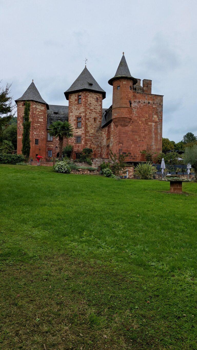 Collonges-la-Rouge castle, medieval tower, village fortifications, red stone skyline village castle ruins, Collonges-la-Rouge, panoramic view, historic site,