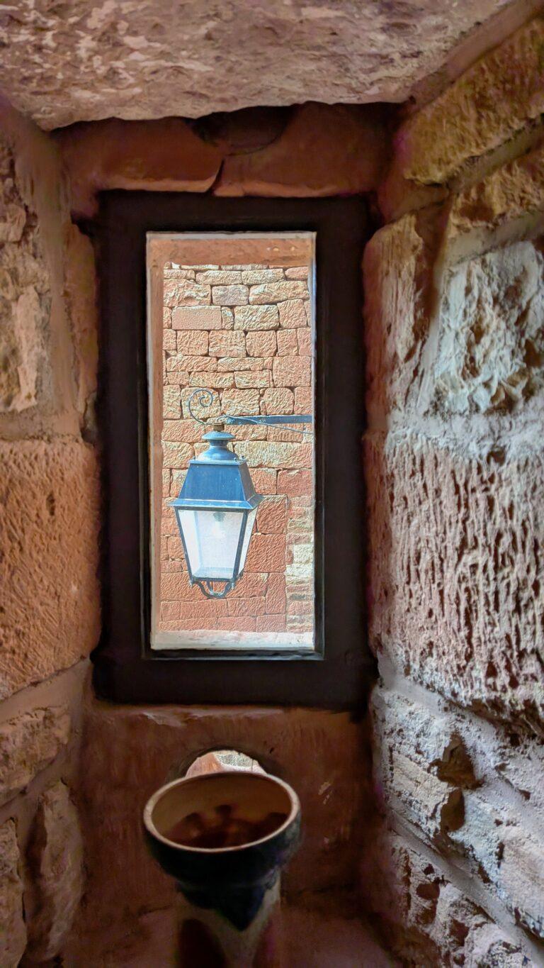 Collonges-la-Rouge castle, medieval tower, village fortifications, red stone skyline village castle ruins, Collonges-la-Rouge, panoramic view, historic site,