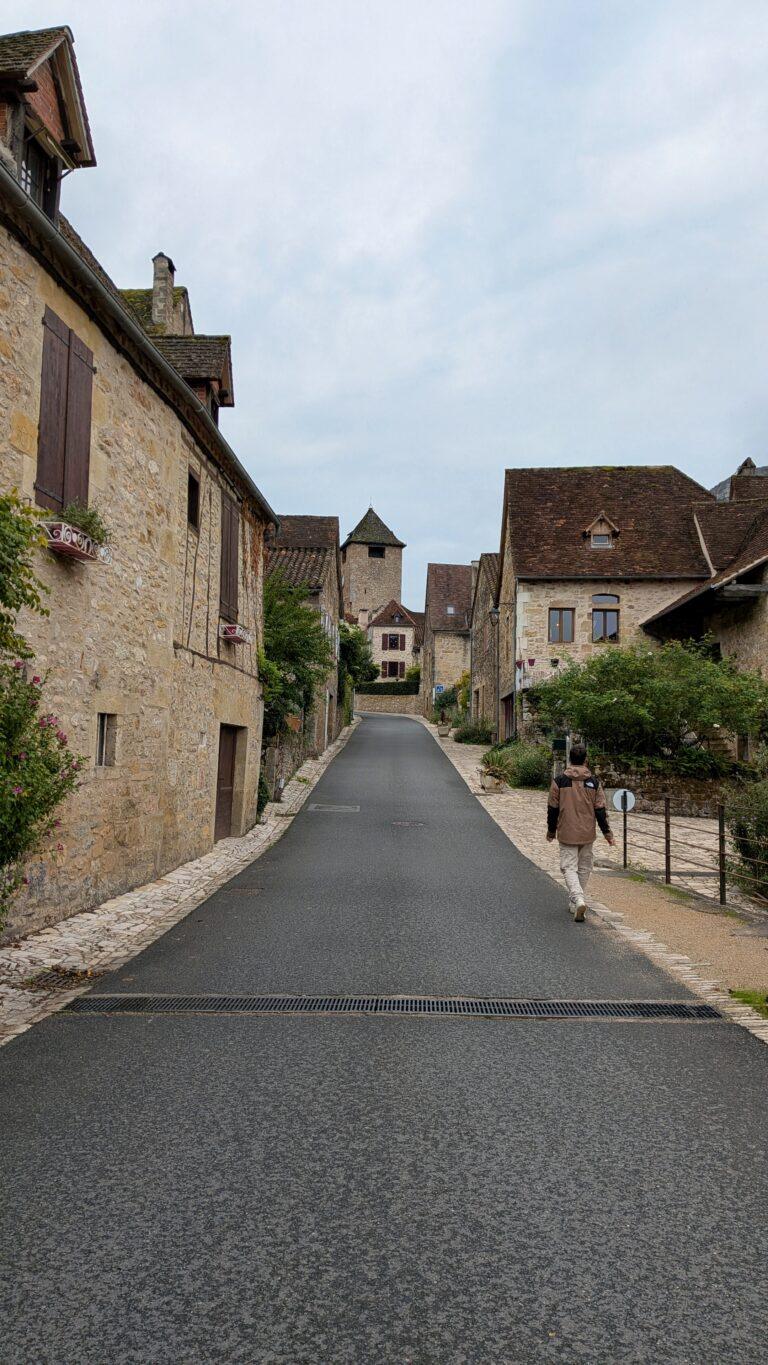 Autoire sunset, golden light, picturesque rooftops, Lot countryside Cascade d’Autoire close-up, waterfall motion, tranquil nature scene, autoire village, golden stone houses, medieval architecture, lot region, france autoire valley, limestone cliffs, picturesque landscape, south west france autoire rooftops, panoramic view, charming french village, countryside scenery, saru's postcards, French village