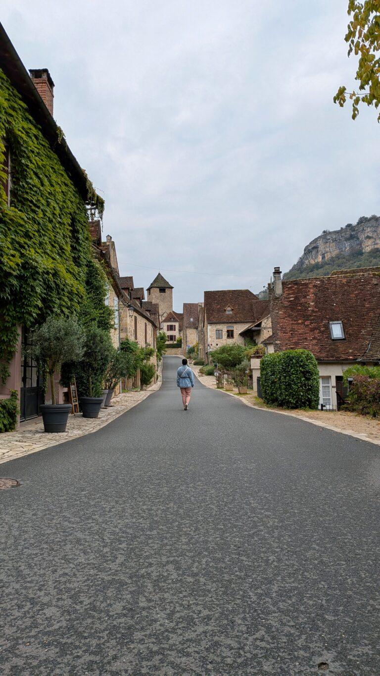 Autoire sunset, golden light, picturesque rooftops, Lot countryside Cascade d’Autoire close-up, waterfall motion, tranquil nature scene, autoire village, golden stone houses, medieval architecture, lot region, france autoire valley, limestone cliffs, picturesque landscape, south west france autoire rooftops, panoramic view, charming french village, countryside scenery, saru's postcards, French village