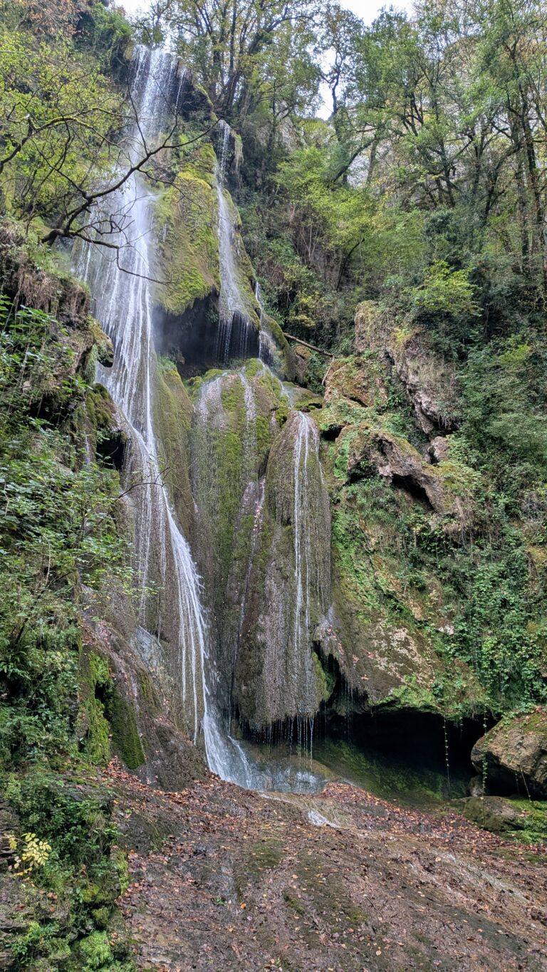 Autoire sunset, golden light, picturesque rooftops, Lot countryside Cascade d’Autoire close-up, waterfall motion, tranquil nature scene, autoire village, golden stone houses, medieval architecture, lot region, france autoire valley, limestone cliffs, picturesque landscape, south west france autoire rooftops, panoramic view, charming french village, countryside scenery, saru's postcards, French village